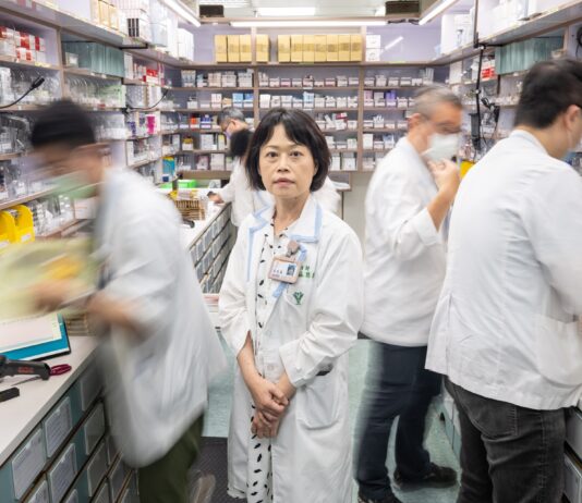 Taiwan Hospital Uses AI to Ease Workload for Medical Staff A group of people in a pharmacy