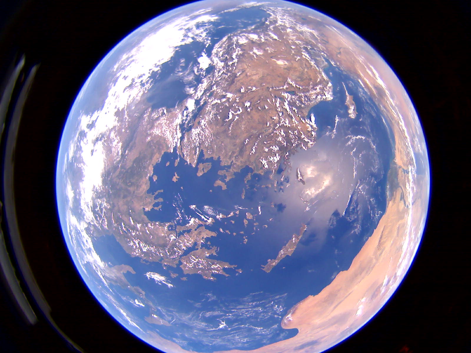 2024 08 27 17 04 33 384 1600x1200 comp 15.jpg View of Earth from orbit, appearing as a globe, fully illuminated with sunlight.
