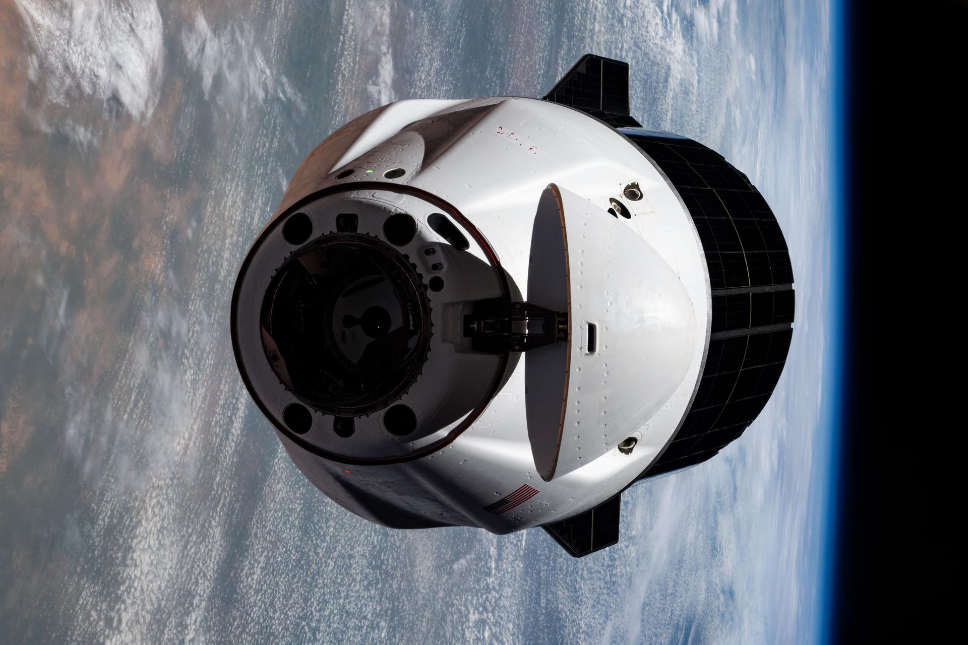 A SpaceX Dragon cargo spacecraft with its nosecone open and carrying over 5,000 pounds of science, supplies, and hardware as NASA