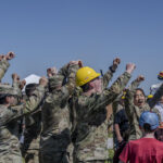 NASA Selects 2025 Student Launch Challenge Teams Students raise their hands in celebration and cheer after a successful launch of their vehicle in the 2024 Student Launch competition.