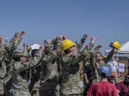 NASA Selects 2025 Student Launch Challenge Teams Students raise their hands in celebration and cheer after a successful launch of their vehicle in the 2024 Student Launch competition.