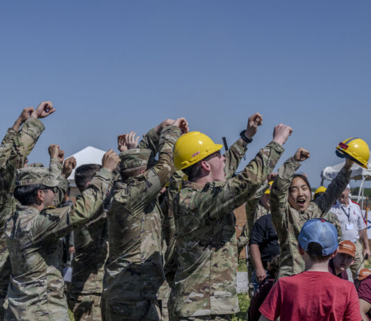 NASA Selects 2025 Student Launch Challenge Teams Students raise their hands in celebration and cheer after a successful launch of their vehicle in the 2024 Student Launch competition.