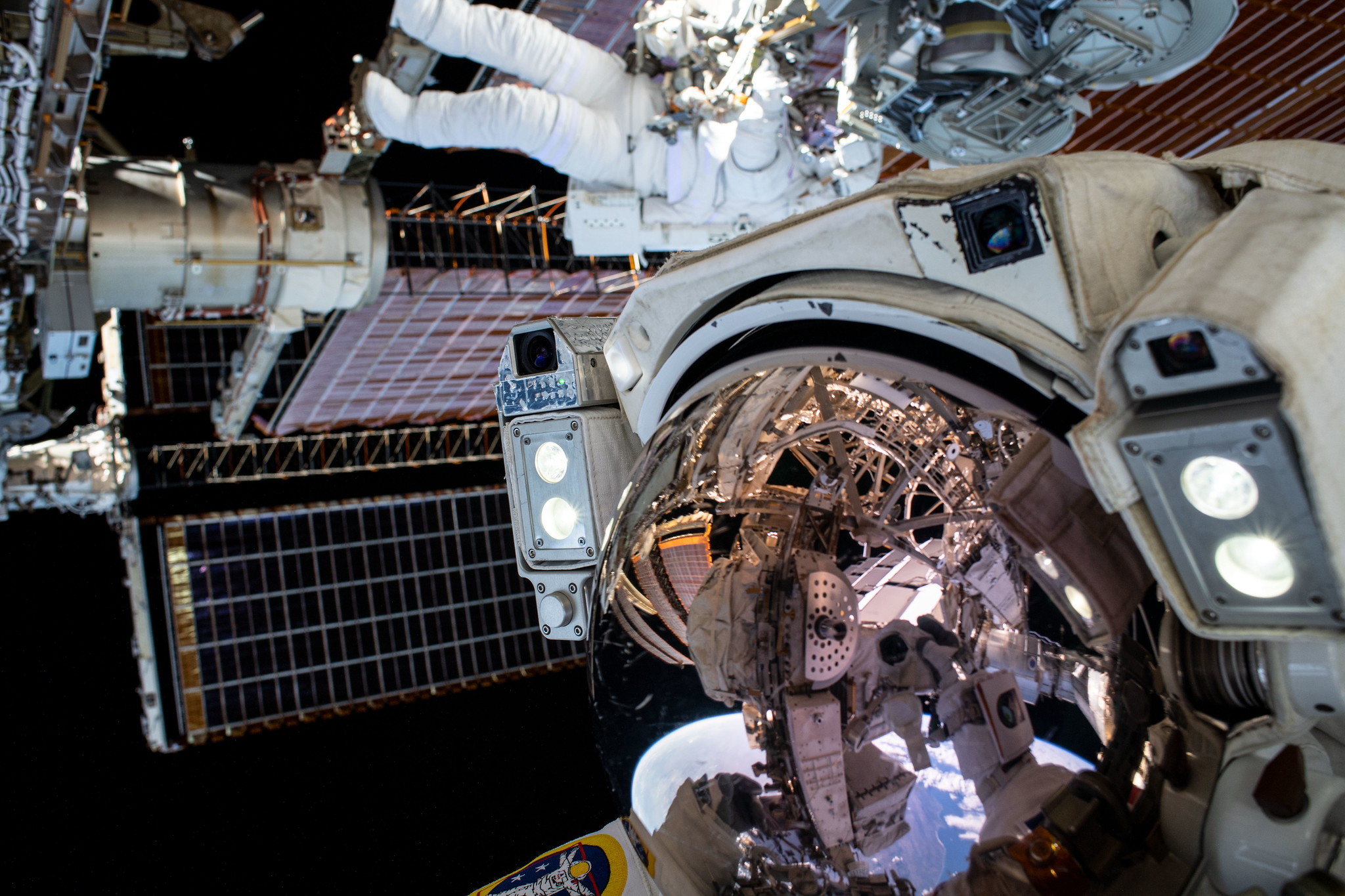 51276996483 8a47cff873 k.jpg This unique "space-selfie" from spacewalker Thomas Pesquet of ESA (European Space Agency) captures he and NASA spacewalker Shane Kimbrough as they work to complete the installation of the second roll out solar array on the International Space Station