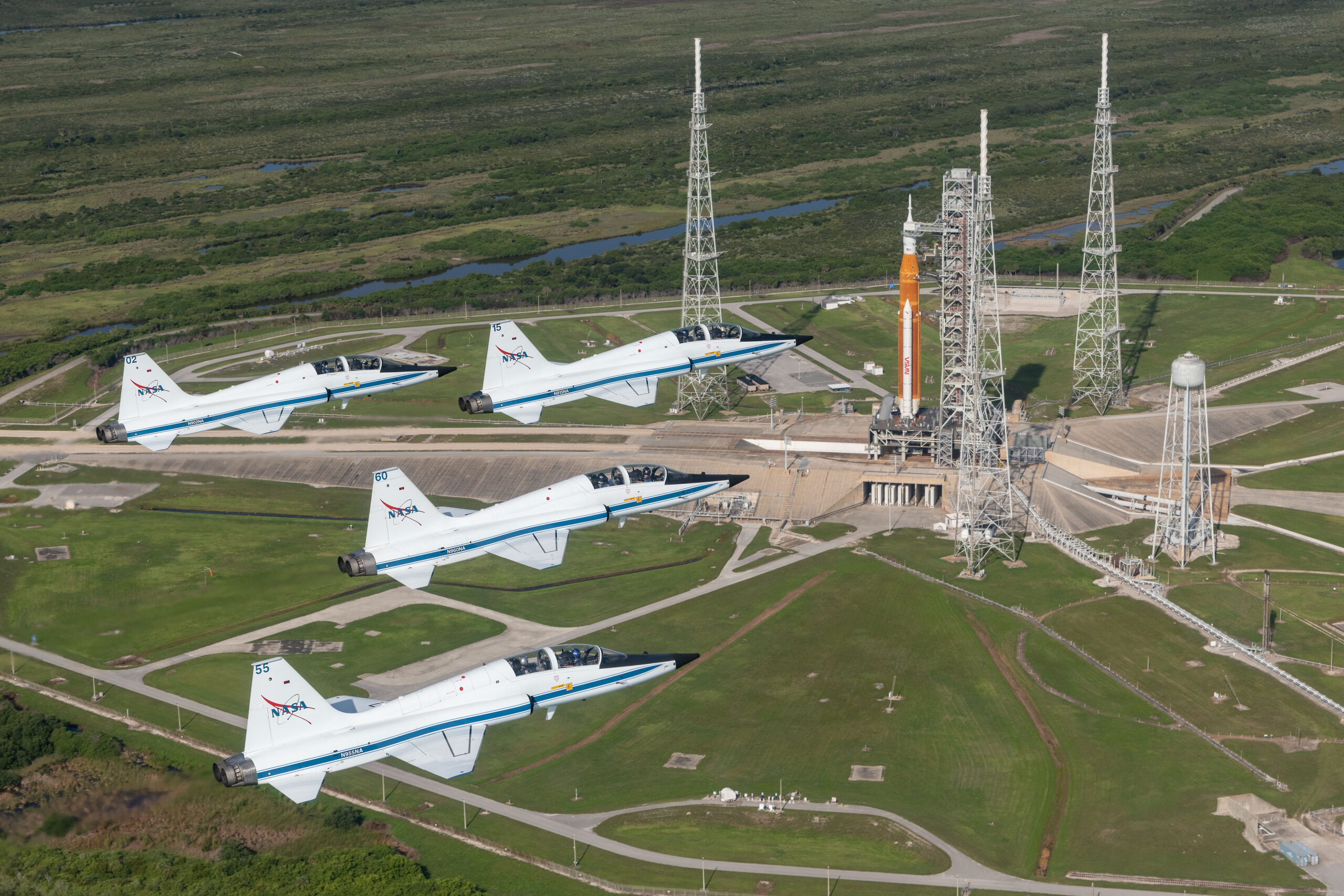 52310837270 83eca00989 o.jpg NASA T-38s fly in formation above the Space Launch System rocket on Launch Pad 39B.