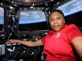 NASA Announces Retirement of Astronaut Jeanette Epps A black woman in a red shirt poses in the International Space Station cupola with the Earth pictured behind her.