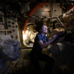 Astronaut Tracy C. Dyson to Address Science, Space Station Mission NASA astronaut Tracy C. Dyson, with floating hair and lit with the glow of a small lamp, smiles as she works at a computer station aboard the International Space Station.