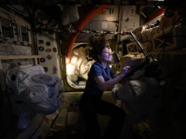 Astronaut Tracy C. Dyson to Address Science, Space Station Mission NASA astronaut Tracy C. Dyson, with floating hair and lit with the glow of a small lamp, smiles as she works at a computer station aboard the International Space Station.