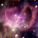 NASA’s IC Stars Initiative Unveiled Material resembling a tangle of dark pink hair swirls dramatically across the image. The picture is dotted with dozens of colorful orbs in various sizes.