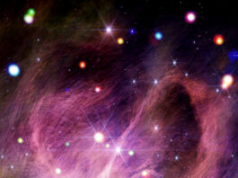 NASA’s IC Stars Initiative Unveiled Material resembling a tangle of dark pink hair swirls dramatically across the image. The picture is dotted with dozens of colorful orbs in various sizes.