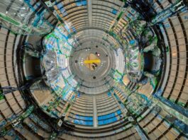 NASA’s Gateway: Deep Space Connectivity Achieved As we look through a circular piece of Gateway, a space station that will be in lunar orbit, there are blue wires snaking through. The wires are covered in clear plastic in some places and held onto the walls by green tape in others.