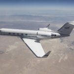 NASA G-IV Aircraft to Test Advanced Science Instrumentation A white Gulfstream IV airplane flies to the left of the frame over a tan desert landscape below and blue mountain ranges in the back of the image. The plane’s tail features the NASA logo, and its wings have winglets. Visible in the lower right third of the image, directly behind the airplane’s wingtip is the Mojave Air and Space Port in Mojave, California.