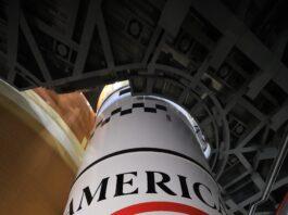 NASA’s Lunar Rocket Marks 250 Years of U.S. Ingenuity Image shows the America 250 logo in black, red, blue colors painted on the white solid rocket boosters of NASA