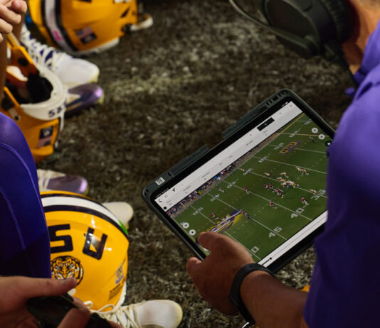 iPad partners with college football, revolutionizing the game. Driving the game forward: iPad teams up with college football