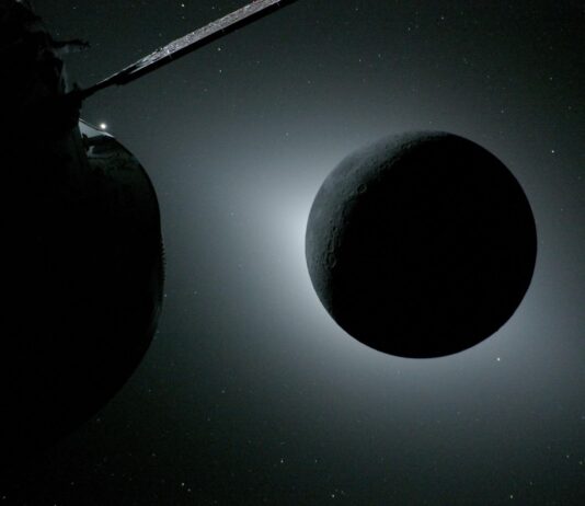 NASA’s Artemis II Crew Shares Official Moon Flyby Photos with Earth The Moon, backlit by the Sun during a solar eclipse, is photographed by NASA’s Orion spacecraft on April 6, 2026, during the Artemis II mission. Orion is visible in the foreground on the left. Earth is reflecting sunlight at the left edge of the Moon, which is slightly brighter than the rest of the disk. The bright spot visible just below the Moon’s bottom right edge is Saturn. Beyond that, the bright spot at the right edge of the image is Mars.