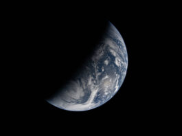 NASA Explores Earth’s Day and Night Cycle in New Study Image of Earth split by the terminator line. The terminator divides Earth’s surface diagonally, shrouding the top left half in darkness. Earth’s illuminated surface is mostly blue and covered in swirling white clouds.