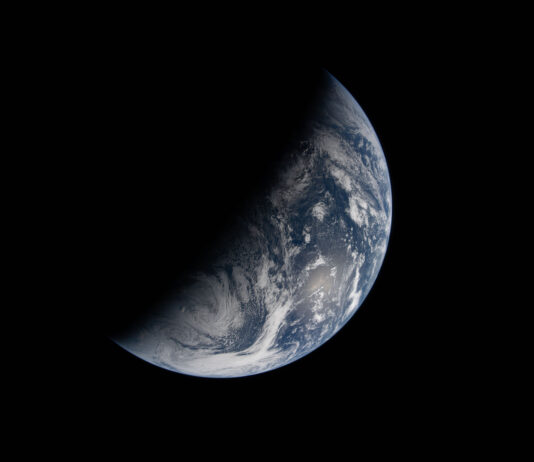 NASA Explores Earth’s Day and Night Cycle in New Study Image of Earth split by the terminator line. The terminator divides Earth’s surface diagonally, shrouding the top left half in darkness. Earth’s illuminated surface is mostly blue and covered in swirling white clouds.