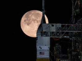 NASA Update on National Space Policy Implementation: What to Expect The Moon is seen shining over the SLS (Space Launch System) and Orion spacecraft, atop the mobile launcher on February 1, 2026. The rocket is currently at Launch Pad 39B at NASA’s Kennedy Space Center in Florida, as teams are preparing for a wet dress rehearsal to practice timelines and procedures for the launch of Artemis II.