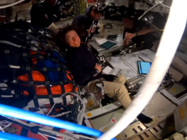 NASA’s Artemis II Sets Record for Farthest Human Spaceflight The Artemis II crew floats in Orion; NASA astronaut Christina Koch smiles at the camera as NASA a