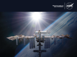 NASA Advisory Panel Unveils 2024 Safety Report Annual report cover art featuring the International Space Station orbiting the Earth, with the sun shining behind it. The NASA logo is in the top left corner. The title at the bottom says,