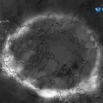 NASA Science Spotlight: Helio Updates for May 2025 A grayscale top-down image of the North Pole showing the glowing band of the Northern Lights circling the Earth