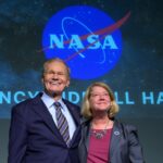 NASA Officials to Communicate with Space Station Astronauts NASA Administrator Bill Nelson, and NASA Deputy Administrator Pam Melroy, react as they are recognized by employees during a NASA agencywide all hands on Dec. 6, 2024, at the NASA Headquarters Mary W. Jackson Building in Washington.