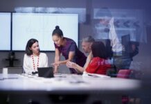 Lenovo 360 Earns 5-Star Rating in 2026 CRN Partner Program Guide brand image - Diverse group of a team of co-workers having a meeting in a conference room.