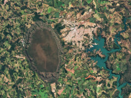 NASA Observes Central Brazil’s Cerrado Ecosystem A dark-green and brown oval-shaped plateau oriented north-to-south is prominent toward the left side of this satellite image of Brazil. A reservoir with branching arms takes up the right side of the image, and a light-colored developed area sits between the plateau and reservoir. A patchwork of irregularly shaped fields surrounds those features.