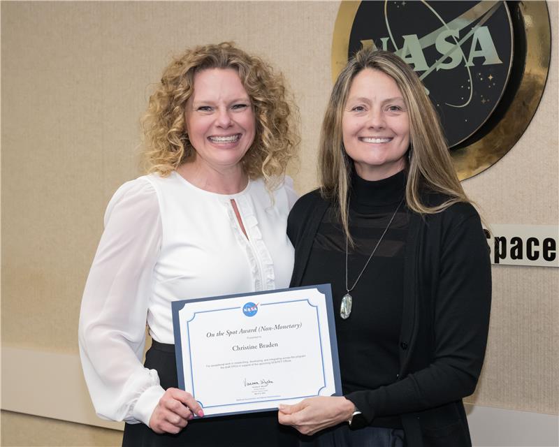 christine award image.jpg Christine Braden receives an “On the Spot” award from Angela Hart, program manager for NASA’s Commercial Low Earth Orbit Development Program, in March 2024 (Credit: NASA/Helen Arase Vargas).