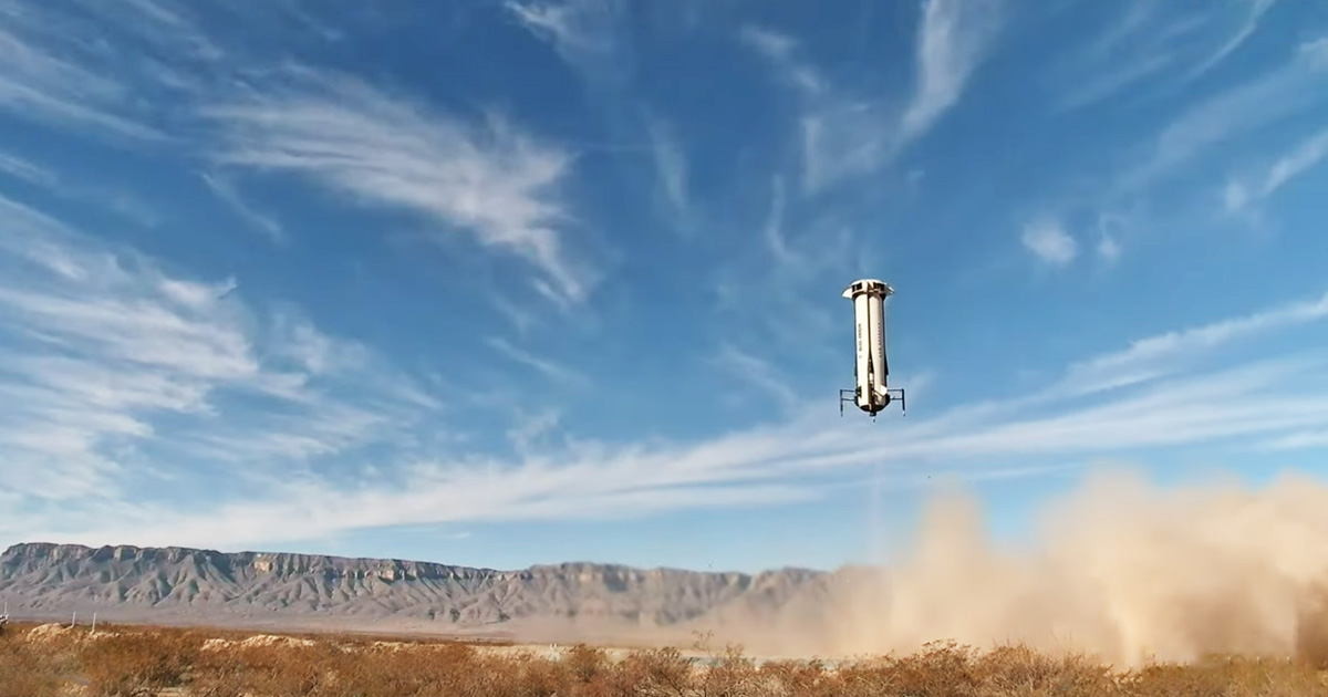 credit blue origin ns29 booster landing.jpg New Shepard booster landing in a field with blue sky in distance.