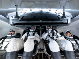 Media Invited to Witness SpaceX Crew-10 Launch to ISS Four NASA SpaceX Crew-10 members sit in a capsule in their white spacesuits, looking around the spacecraft during training.