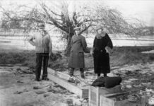 NASA Celebrates a Century of Progress in Rocketry black-and-white photograph of a trio of people standing outdoors with wooden crates at their feet