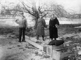NASA Celebrates a Century of Progress in Rocketry black-and-white photograph of a trio of people standing outdoors with wooden crates at their feet