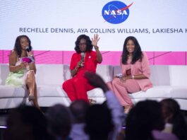 NASA Shines at 2024 ESSENCE Fest in New Orleans A 3-member panelists of women sit on a white sofa to lead Taking Up Space conversation at Essence Fest; The NASA meatball can be seen on the screen in the background
