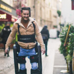 Wandercraft Launches Trials for AI-Driven Personal Exoskeleton man using exoskeleton to walk in Paris