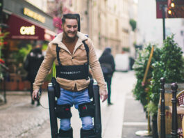 Wandercraft Launches Trials for AI-Driven Personal Exoskeleton man using exoskeleton to walk in Paris