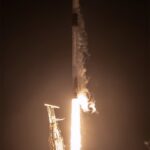 NASA’s EZIE Begins Mission to Explore Earth’s Electrojets : A rocket lifts off from a launch pad at night, with the scene lit by rocket’s bright trail. Clouds of vapor billow out on the ground and from the rockets upper half.