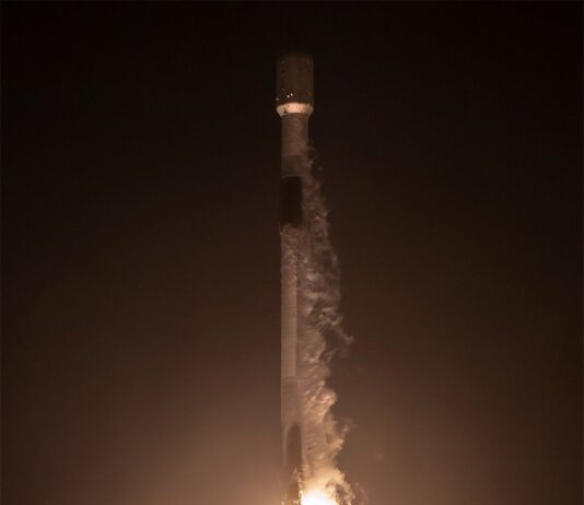 NASA’s EZIE Begins Mission to Explore Earth’s Electrojets : A rocket lifts off from a launch pad at night, with the scene lit by rocket’s bright trail. Clouds of vapor billow out on the ground and from the rockets upper half.