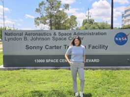 Farah Al Fulfulee: Pursuing Her NASA Dream to the Stars A woman in casual clothes poses in front of a sign for the Johnson Space Center
