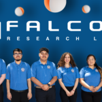 Community College Project Wins NASA University Research Program Grant Six people, including community college students, in blue shirts stand in front of a blue background with white text and graphics.