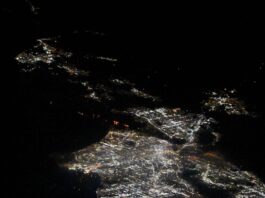 NASA Captures Los Angeles Fires from Space Station A view of Los Angeles, California from the International Space Station. The fires appear as orange lights just above center, in between two areas brightly lit by city lights.