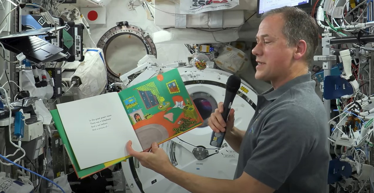 goodnight moon.jpg NASA astronaut Thomas Marshburn, holding the book