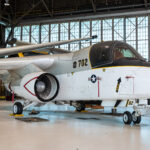 NASA Donates S-3B Viking to POW/MIA Museum The S-3B Viking aircraft rests in the NASA Glenn Hangar. The plane is painted gray, black, and white. The wings are folded atop the aircraft.