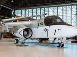 NASA Donates S-3B Viking to POW/MIA Museum The S-3B Viking aircraft rests in the NASA Glenn Hangar. The plane is painted gray, black, and white. The wings are folded atop the aircraft.