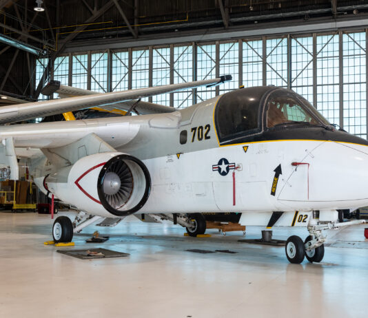 NASA Donates S-3B Viking to POW/MIA Museum The S-3B Viking aircraft rests in the NASA Glenn Hangar. The plane is painted gray, black, and white. The wings are folded atop the aircraft.
