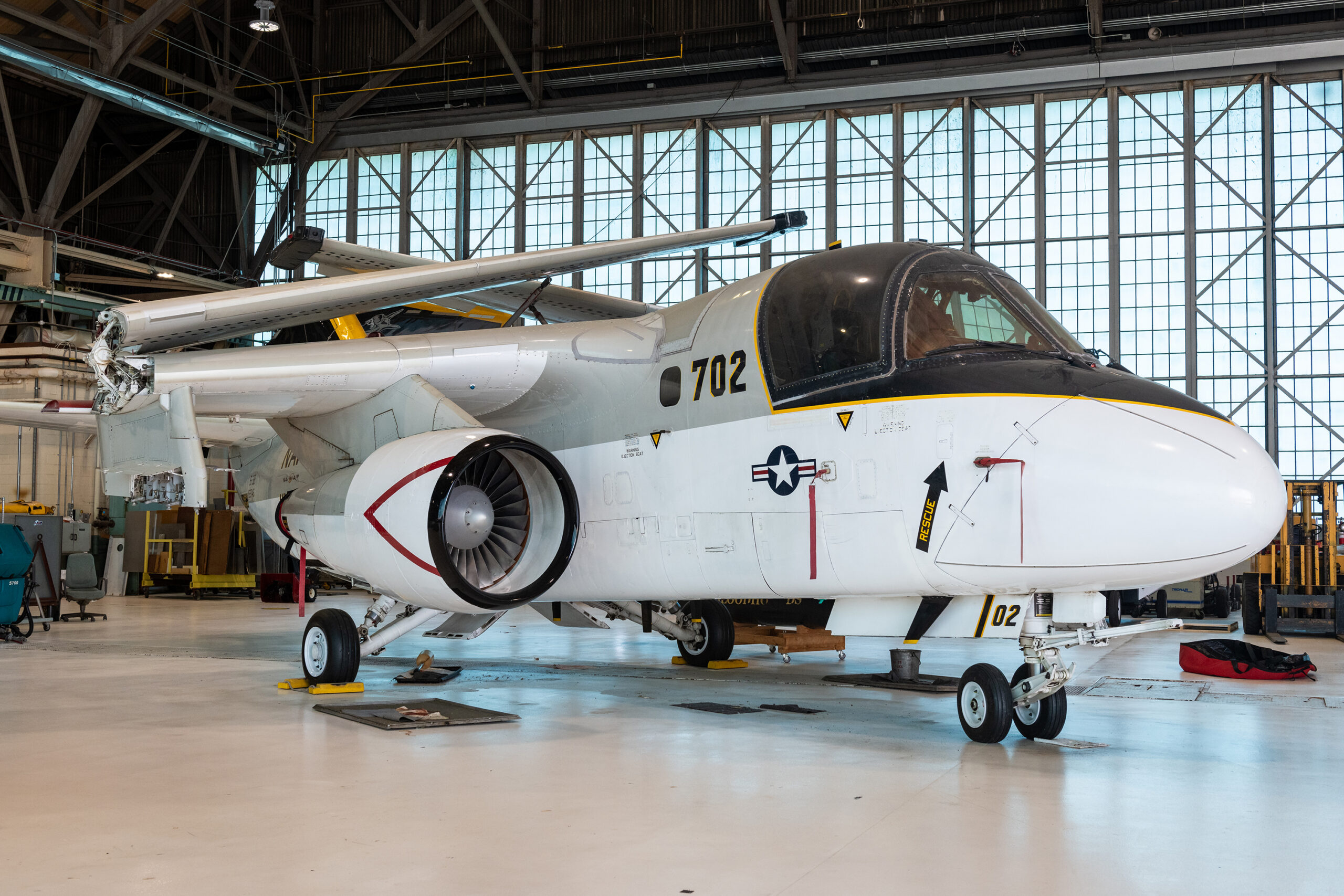grc 2024 c 05028.jpg The S-3B Viking aircraft rests in the NASA Glenn Hangar. The plane is painted gray, black, and white. The wings are folded atop the aircraft.
