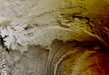 2015 Eclipse Shadow Photographed by NASA’s Terra Satellite Clouds over the Arctic Ocean almost look like the sea