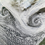NASA Studies Cyclones in Iceland Two cyclones swirl south of Iceland in this satellite image. While the two storms