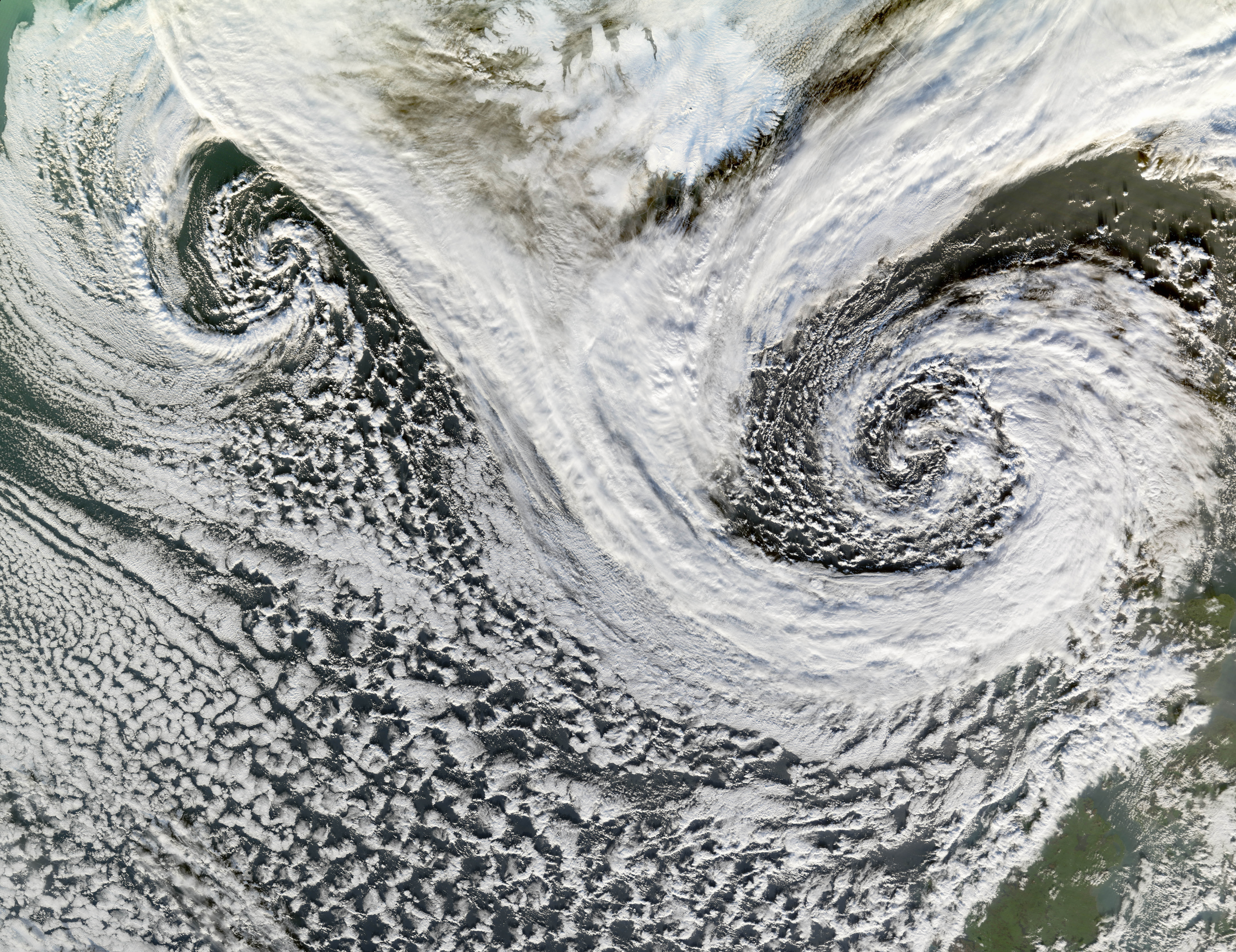 gsfc 20171208 archive e002167orig.jpg Two cyclones swirl south of Iceland in this satellite image. While the two storms