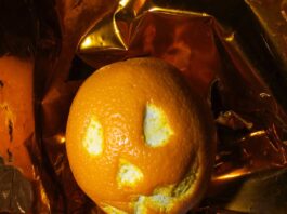 NASA Celebrates Halloween Aboard the International Space Station An orange dressed as a pumpkin for Halloween