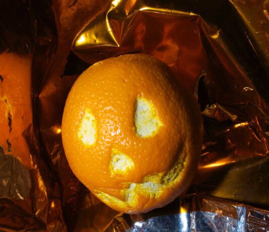 NASA Celebrates Halloween Aboard the International Space Station An orange dressed as a pumpkin for Halloween
